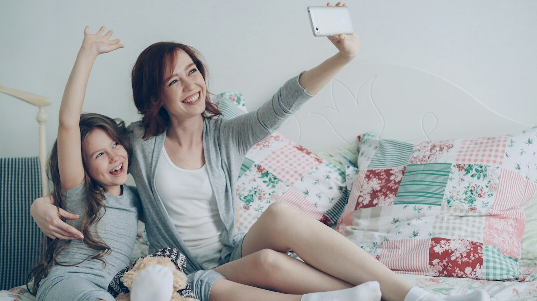 Multi-generation Singaporean family relaxing together at home