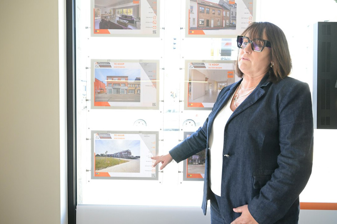 Insurance advisor explaining a health plan brochure to a client at a desk